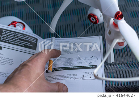 A man reads the instructions to the quadcopter 41644627