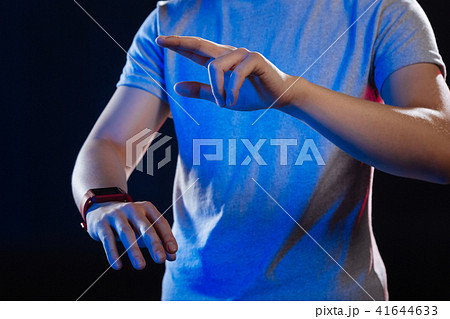 Nice young man using his watch Nice young man using his watch 41644633