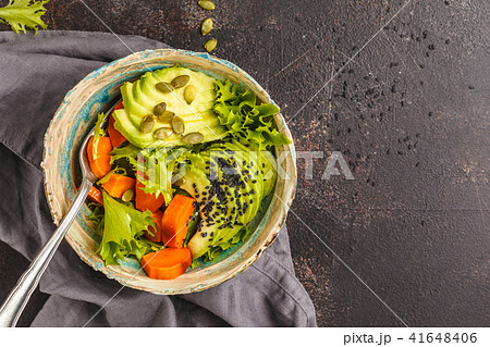 Vegan salad, rainbow bowl with baked sweet potato Vegan salad, rainbow bowl with baked sweet potato 41648406