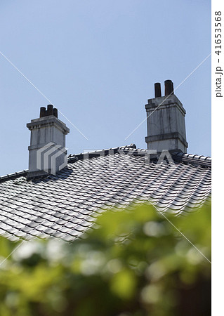 洋館の屋根と煙突の写真素材