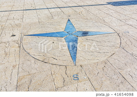Symbolic compass on the ground 41654098