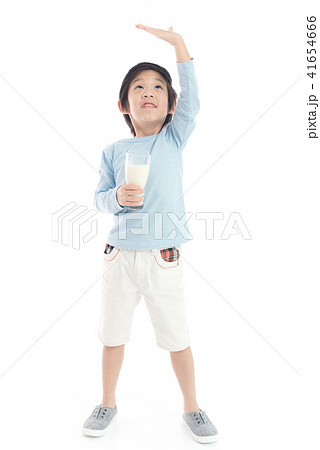 child drinking milk from a glass child drinking milk from a glass 41654666