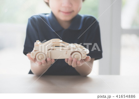 Asian child playing wooden model car 41654886