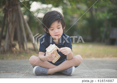 Cute Asian child playing wooden model car 41654887