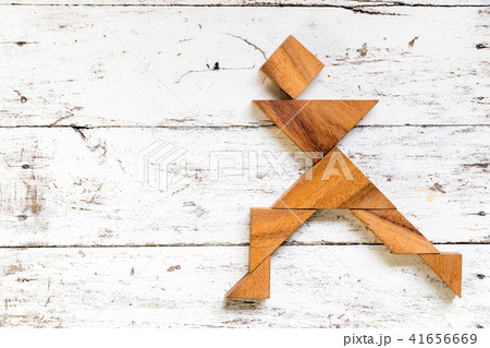 Tangram puzzle in happy running man shape Tangram puzzle in happy running man shape 41656669