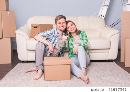 Happy love couple in her new home holding key 41657541