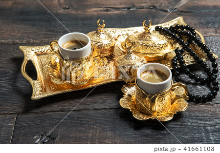 Golden coffee cups rosary beads Ramadan kareem 41661108