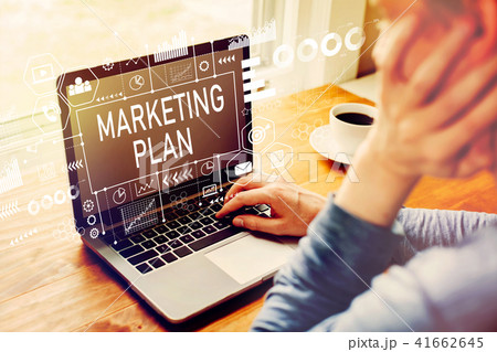 Marketing plan with man using a laptop 41662645