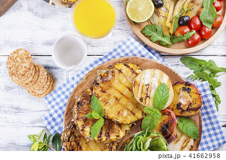 fruit, various grilled snacks, for a summer lunch. Healthy food. Appetizers on a white background. fruit, various grilled snacks, for a summer lunch. Healthy food. Appetizers on a white background. 41662958