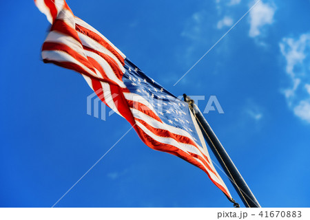 Star-striped American flag flutters  41670883