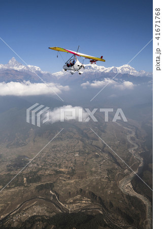 Ultralight plane and trike fly and Machapuchare Ultralight plane and trike fly and Machapuchare 41671768