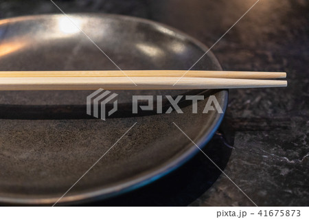 wooden chopsticks on ceramic dish wooden chopsticks on ceramic dish 41675873