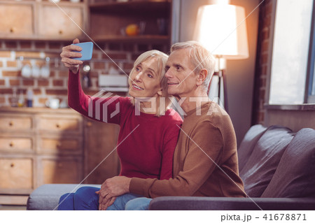 Mature loving couple posing on camera Mature loving couple posing on camera 41678871