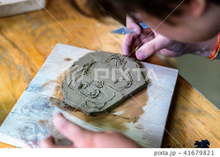 Pottery workshop. hands make print on clay 41679821