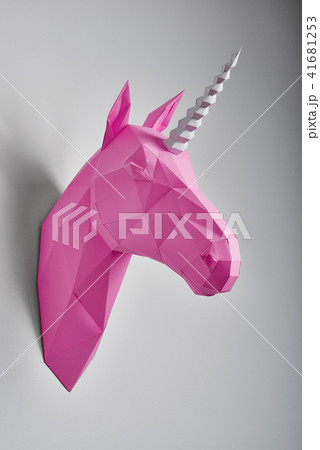 Pink saturated geometrical unicorn's head. 41681253