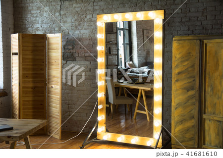 Large full-length mirror in a room with a brick Large full-length mirror in a room with a brick 41681610