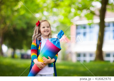 Little child with candy cone on first school day 41682970