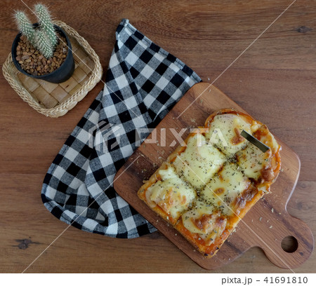 Pizza toasted bread with tomato sauce ham cheese 41691810