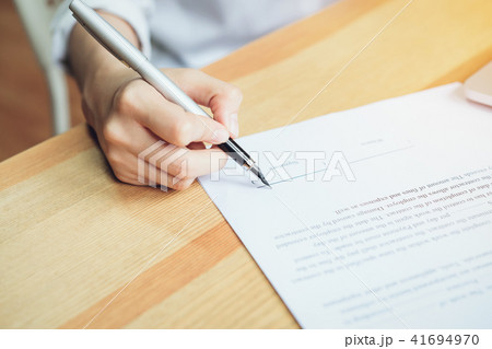 closeup of signing a documentation agreement. 41694970