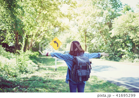Beautiful woman backpack relaxing on the road. Vac 41695299