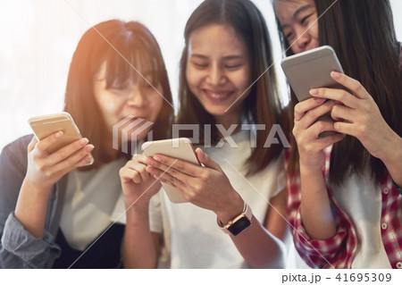 Woman using smartphone for the application. 41695309