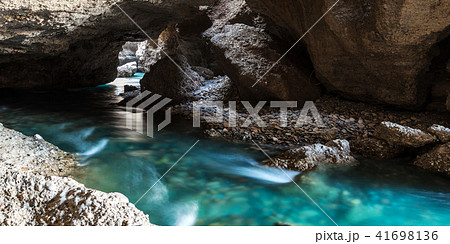 Panorama of the underground lake in a cave of bright blue color Panorama of the underground lake in a cave of bright blue color 41698136