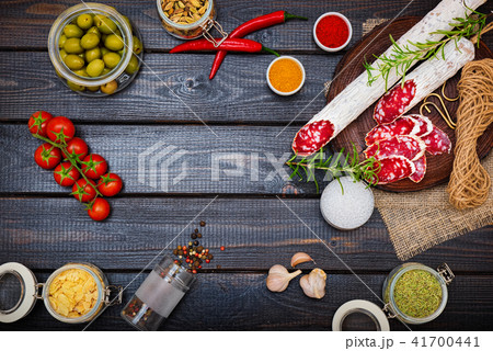 Sliced cured sausage, meat with spices. Sliced cured sausage, meat with spices. 41700441