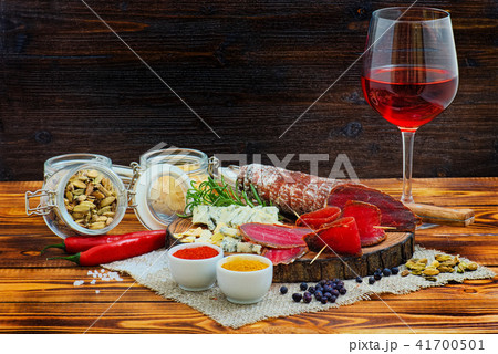 Sliced cured sausage, meat with spices. Sliced cured sausage, meat with spices. 41700501