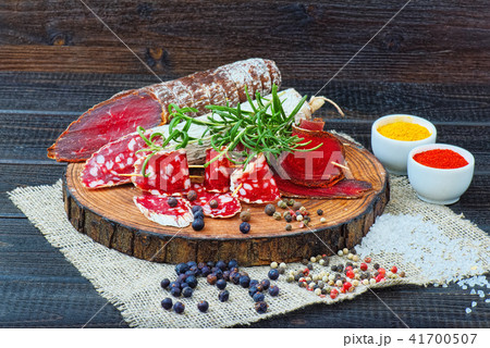 Sliced cured sausage, meat with spices. Sliced cured sausage, meat with spices. 41700507