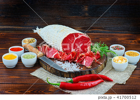 Sliced cured sausage, meat  with spices. 41700512