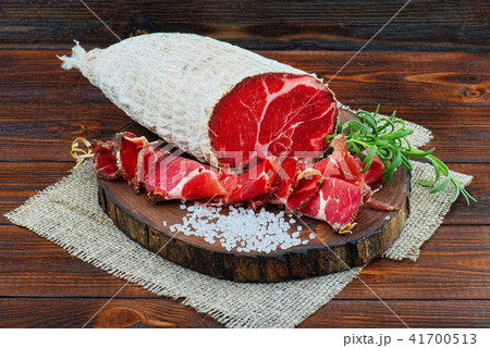 Sliced cured sausage, meat  with spices. 41700513