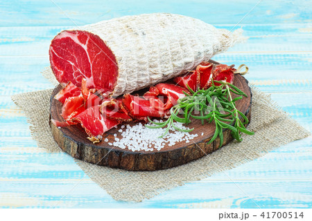 Sliced cured sausage, meat  with spices. 41700514