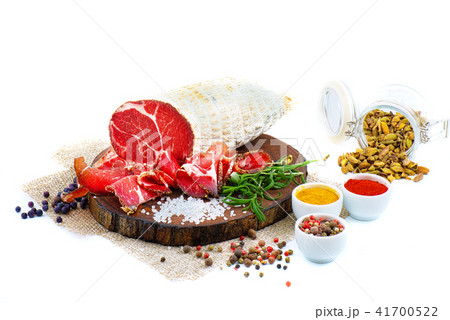 Sliced cured sausage, meat with spices. Sliced cured sausage, meat with spices. 41700522