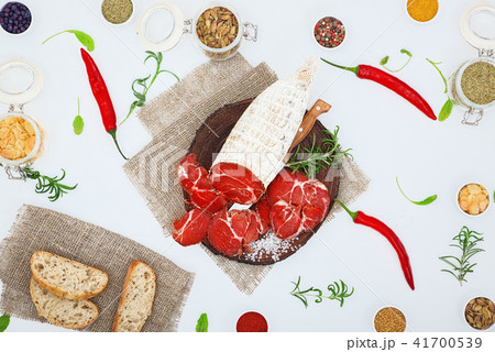 Sliced cured sausage, meat  with spices. 41700539
