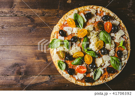 Traditional italian pizza on wooden table 41706392