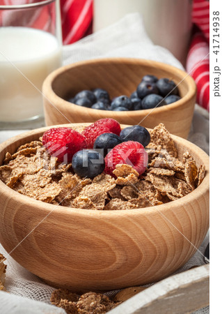 Bowl of cereals with blueberries and raspberrie. Bowl of cereals with blueberries and raspberrie. 41714938