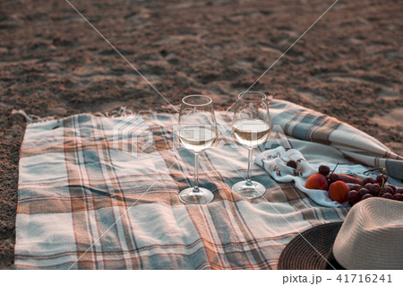 A party on the beach at sunset with wine. Romantic evening in the summer by the sea. Picnic. copy A party on the beach at sunset with wine. Romantic evening in the summer by the sea. Picnic. copy 41716241