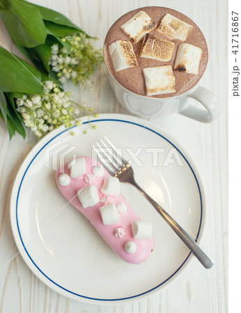 Coffee and eclair the rustic background Coffee and eclair the rustic background 41716867