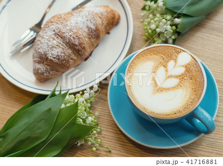 Coffee and croissant on the rustic background Coffee and croissant on the rustic background 41716881
