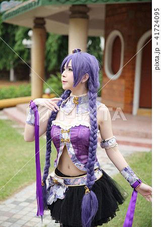 Portrait of asian young woman dancing with purple Chinese dress cosplay with temple 41724095