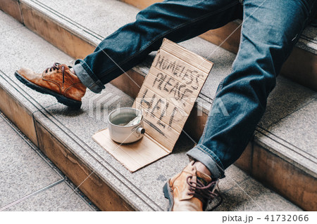 Old homeless person sleeping on stairs 41732066