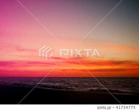 Orange and pink sunset sky over the beach 41734775
