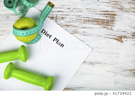 Apple, diet plan,dumbbells and measuring tape 41739422