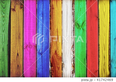 Close-up of bright vertical colorful oak wooden fence background. Creative art backdrop.Vintage Close-up of bright vertical colorful oak wooden fence background. Creative art backdrop.Vintage 41742469