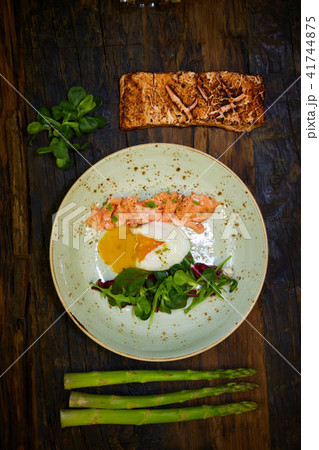Slow Cooked Salmon fillet steak with salad on plate, Sous-Vide Cooking Salmon Fish Slow Cooked Salmon fillet steak with salad on plate, Sous-Vide Cooking Salmon Fish 41744875