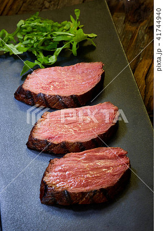 Sous-vide steak cut into pieces, cooked to eat beef on the stone table Sous-vide steak cut into pieces, cooked to eat beef on the stone table 41744940