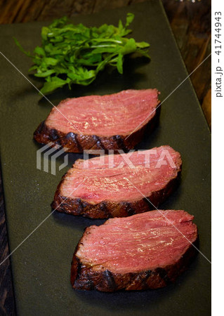 Sous-vide steak cut into pieces, cooked to eat beef on the stone table 41744943