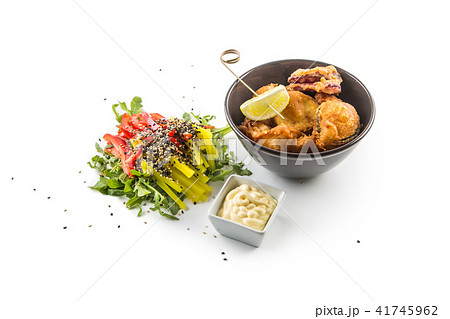 Fried vegetable pieces with sauce and vegetable 41745962
