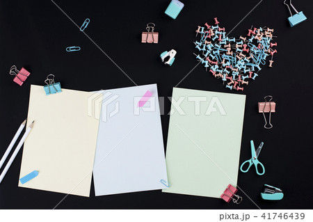 Many multi-colored clips on a black background. Office concept. Subjects for the school. copy space Many multi-colored clips on a black background. Office concept. Subjects for the school. copy space 41746439