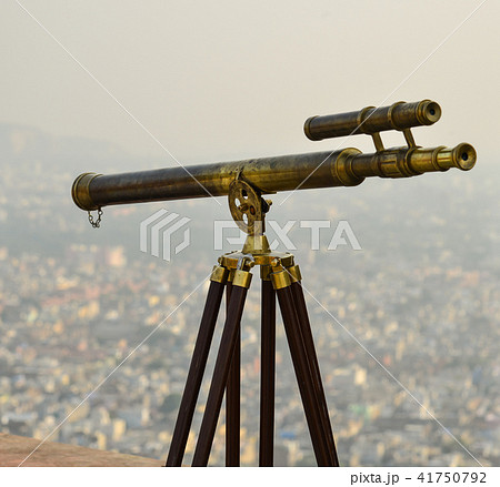 Vintage binocular telescope with cityscape 41750792